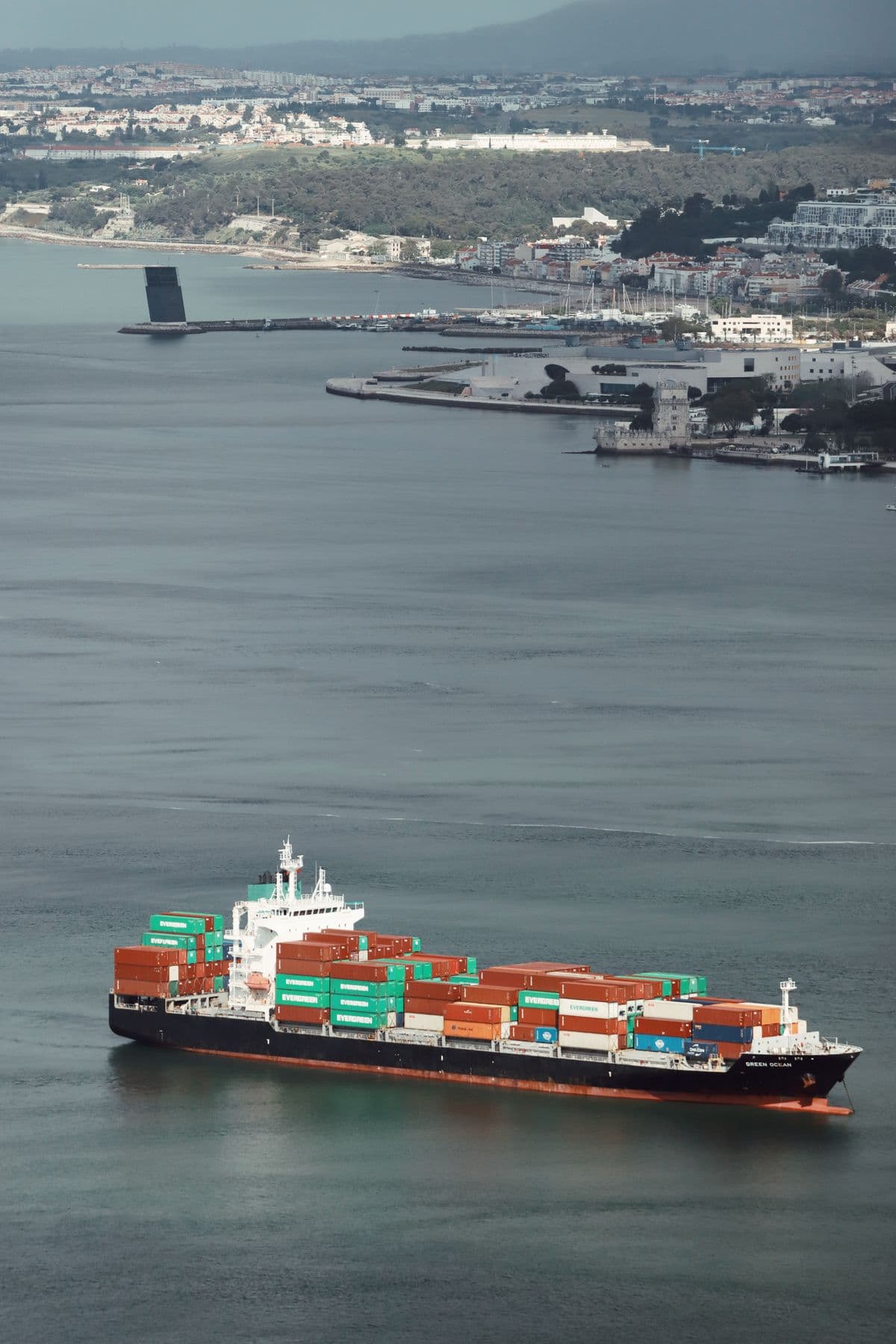 Container ship at port, representing global shipping reach